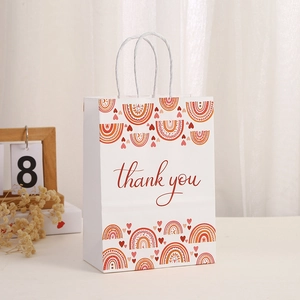 Bohemian rainbow paper gift bag with 'thank you' print and white twisted handles