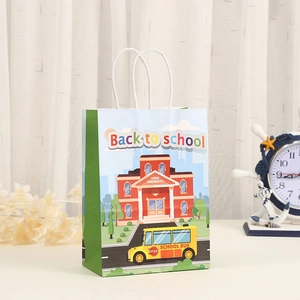 Detail of Back to School paper gift bag with colorful cartoon bus and school house print