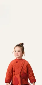 Close-up of winter quilted jacket with Chinese style frog buttons and matching small pouch