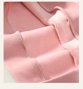 Close-up of pink girls sweatshirt showing warm fleece lining and ribbed cuff detail