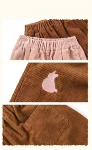 Detailed view of elastic waistband and cute animal embroidery on corduroy kids pants