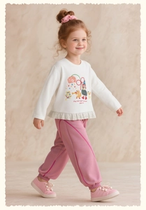 Détail du t-shirt blanc à motif dessin animé et pantalon rose décontracté pour fille