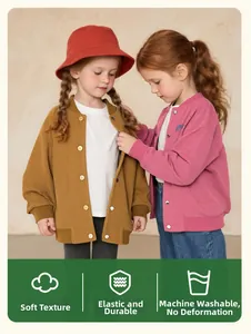 Detail of corduroy baseball jacket for girls featuring ribbed cuffs and soft texture