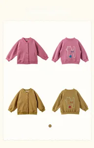 Detail of waffle knit fabric and cute pixel cat pattern on children baseball jackets