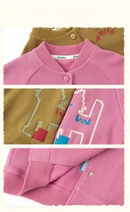 Detailed embroidery of cartoon cat and buttons on girls knit baseball jacket