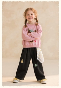 Detailed embroidery of a rabbit and tree on girls black corduroy leisure trousers