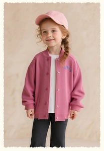 Detail of pink ribbed baseball jacket with blue letter embroidery on the chest