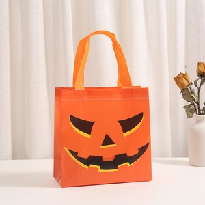 Halloween orange non-woven gift bag with black pumpkin face and sturdy handles