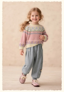 Detail of girls floral knit sweater and grey jogger set with delicate embroidery