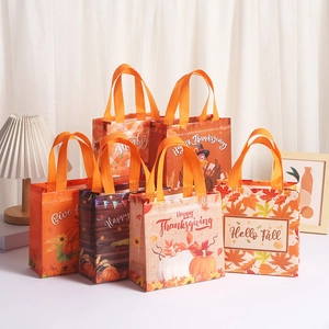 Reusable non-woven Thanksgiving gift bags with pumpkin and turkey prints for parties