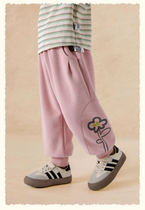 Detail of pink girls' floral jogger pants with ribbed cuffs and simple flower print