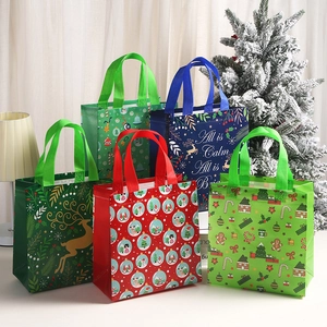 Festive non-woven Christmas gift tote bags with reindeer and gingerbread house prints