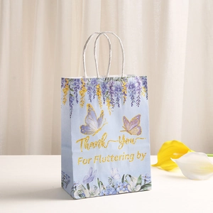 Floral butterfly kraft gift bag in light blue with white handles and Thank You text