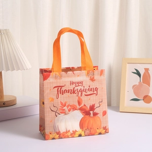 Laminated non-woven Thanksgiving gift bag with pumpkins and sunflowers in cozy home setting