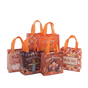 Thanksgiving non-woven gift bags with autumn prints of turkeys pumpkins and fall leaves