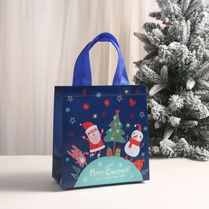 Dark blue Christmas non-woven gift bag with Santa and snowman cartoon prints
