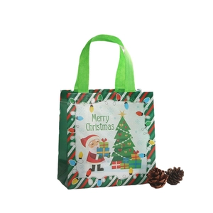 Bolsa de regalo navideña de tela no tejida con Papá Noel y asas verdes resistentes