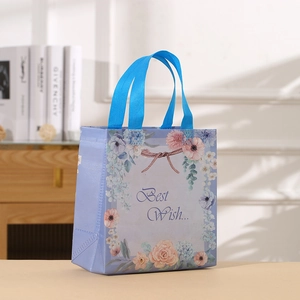 Floral lavender non-woven gift bag with blue handles and Best Wish typography