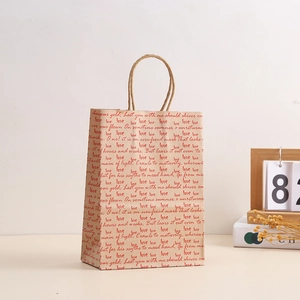Eco-friendly brown kraft paper gift bag with red love prints and durable rope handles
