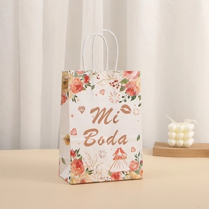 Elegant white wedding paper gift bag with floral Mi Boda design and rope handles