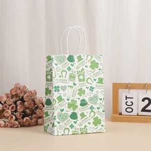 White St. Patrick's Day paper gift bag with green clover patterns and sturdy handles