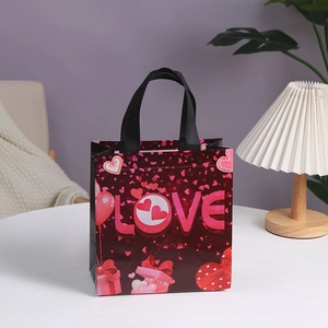 Deep red Valentine's non-woven gift bag with LOVE typography and black ribbon handles