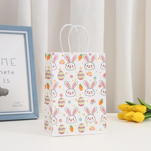 Easter paper gift bag with cartoon rabbit print and white handles for party favors