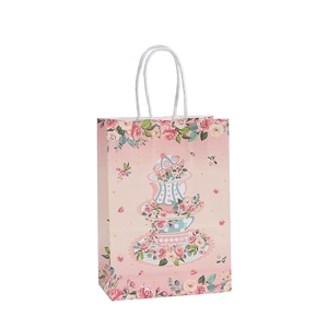 Bolsa de regalo de papel kraft rosa con diseño floral de té y asas blancas