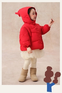 Detailed view of red children hooded down jacket with cute pom-pom and button accents