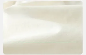 Gros plan sur la texture du tissu en coton blanc cassé respirant pour short d'enfant