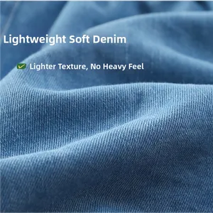Detail of soft lightweight blue denim fabric showing breathable twill texture for kids shorts