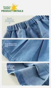 Detail of girl's blue denim pleated skirt featuring elastic waist and high-quality stitching