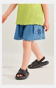 Detail of girl's seersucker top and denim shorts with butterfly embroidery