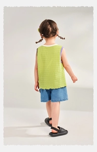 Rear view of girl's grass green pleated sleeveless top and blue denim butterfly shorts set