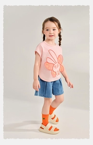 Detail of pink cotton T-shirt with bunny embroidery and blue pleated denim shorts set