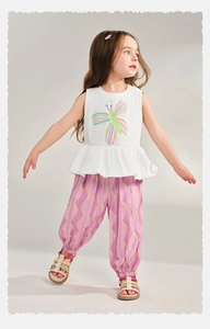 Detail of breathable children summer set featuring floral top and printed mosquito pants