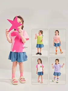 Girls' denim pleated shorts in washed blue, featured in various summer outfit combinations