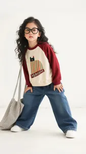 Fashionable girls' wide-leg denim jeans paired with a stylish color-block sweatshirt set