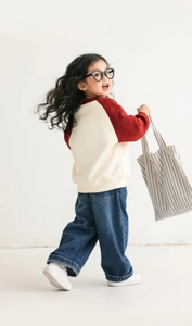 Detail of girls casual wide leg jeans with elastic waistband and high quality denim texture