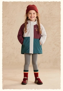 Detail of girls' color-block hooded jacket featuring a burgundy, white, and green design