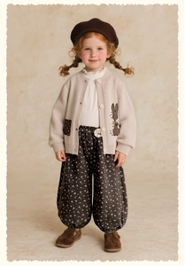 Detail of girls floral pants set with cute bunny embroidery and knit cardigan