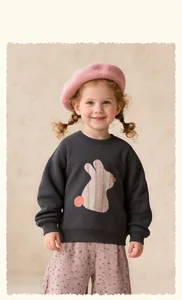 Close-up of girls' grey sweatshirt with pink plaid bunny applique and floral pants