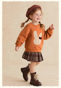 Detail of girls' rabbit embroidery orange sweatshirt and brown plaid pleated skirt set