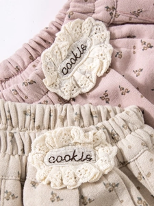 Girls floral print cotton trousers with elastic waistband and cookie embroidery detail