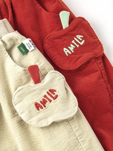 Girls soft corduroy jogger pants with cute apple pocket detail in beige and red colors