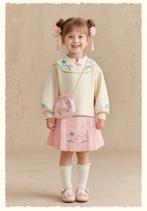 Détails de la jupe plissée rose pour fille avec broderies traditionnelles d'oiseaux