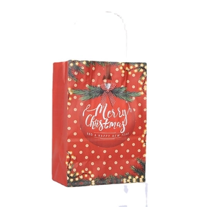 Red Christmas kraft paper gift bag with white polka dots and Merry Christmas ornaments