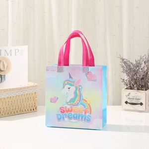 Unicorn non-woven gift bag with Sweet Dreams print and pink handles for birthdays
