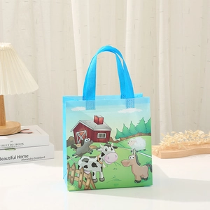 Dettaglio della borsa regalo in tessuto non tessuto blu con animali della fattoria
