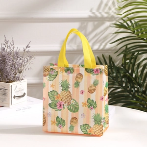 Detail of waterproof non-woven shopping bag with tropical pineapple and floral prints
